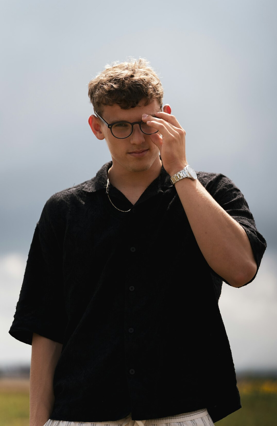 Studio portrait of a Brazilian man with glasses