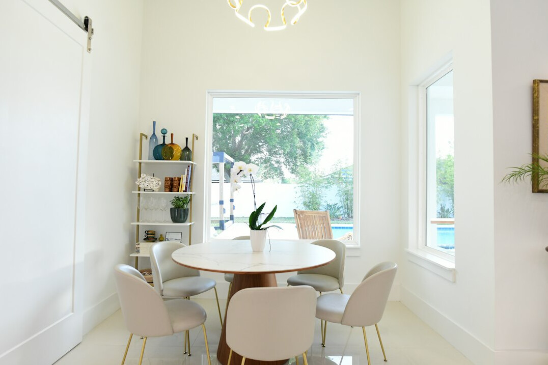 Bright meeting room with people seated for a discussion circle