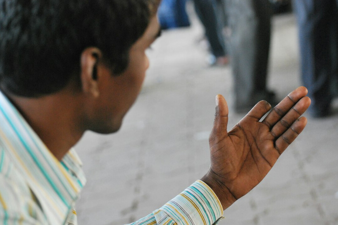 person using hand gestures while speaking