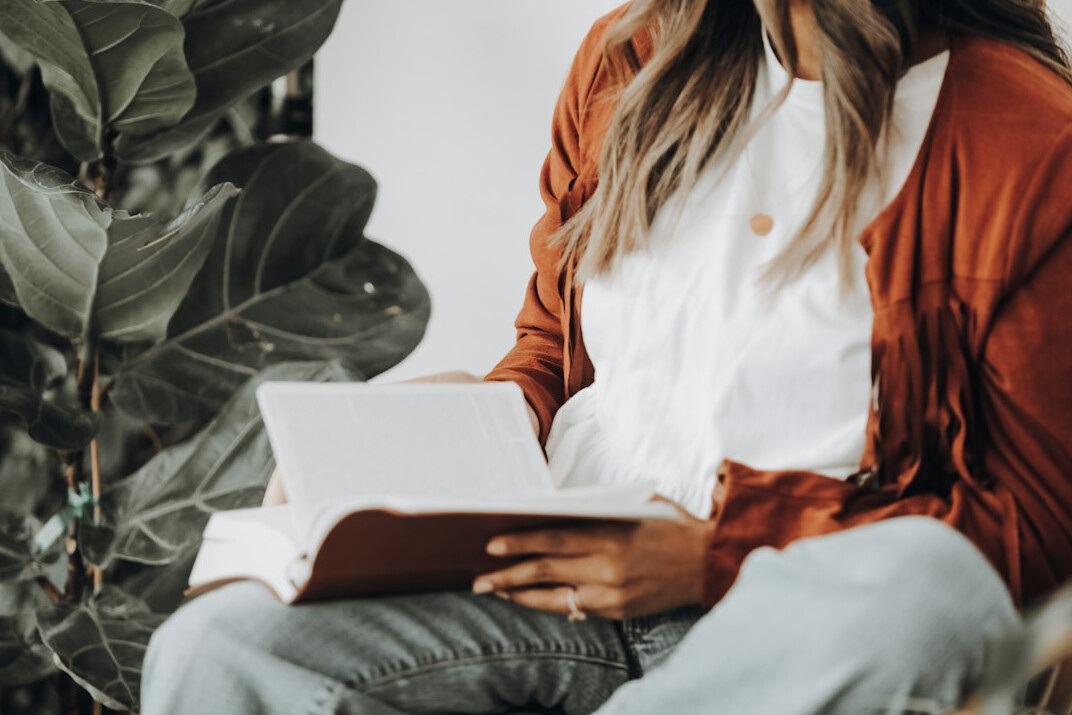 person reading self help book